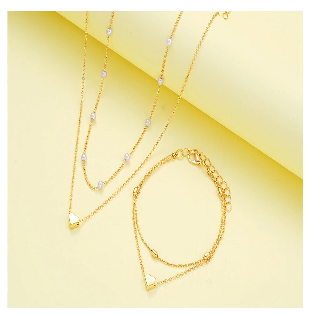 Modisches Schmuckset mit Imitationsperlen und Herzanhänger für Damen, Gold- und Silberfarben, runde Perlen, Halskette und Armband, Accessoires für den Alltag