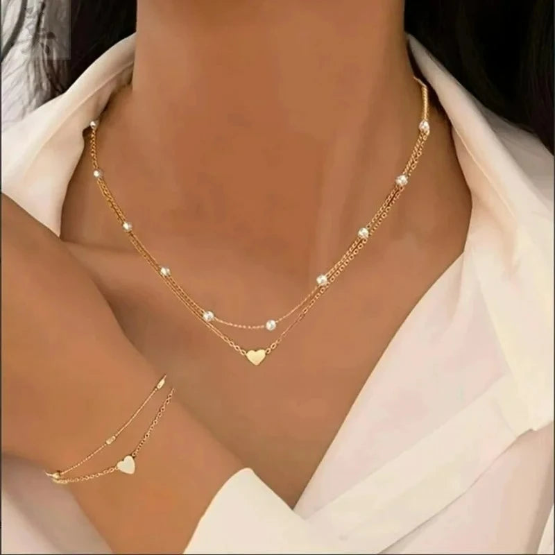 Modisches Schmuckset mit Imitationsperlen und Herzanhänger für Damen, Gold- und Silberfarben, runde Perlen, Halskette und Armband, Accessoires für den Alltag