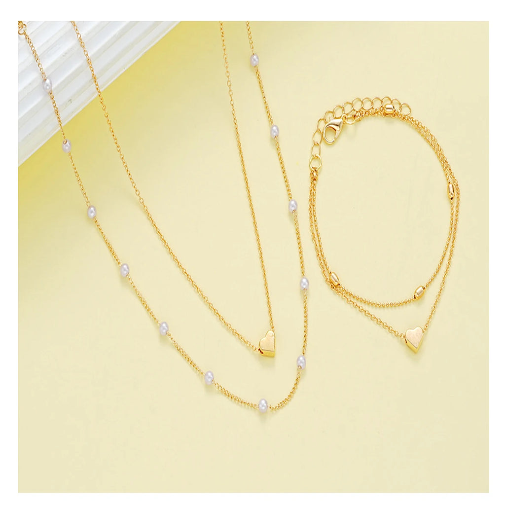 Modisches Schmuckset mit Imitationsperlen und Herzanhänger für Damen, Gold- und Silberfarben, runde Perlen, Halskette und Armband, Accessoires für den Alltag